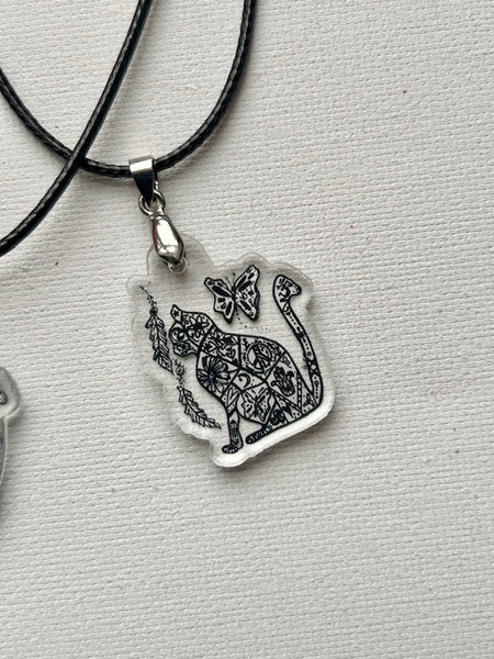 Cat with Art and Symbols on a Necklace - OM Cat