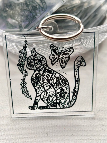 Cat with Art and Symbols on a Keychain - OM Cat
